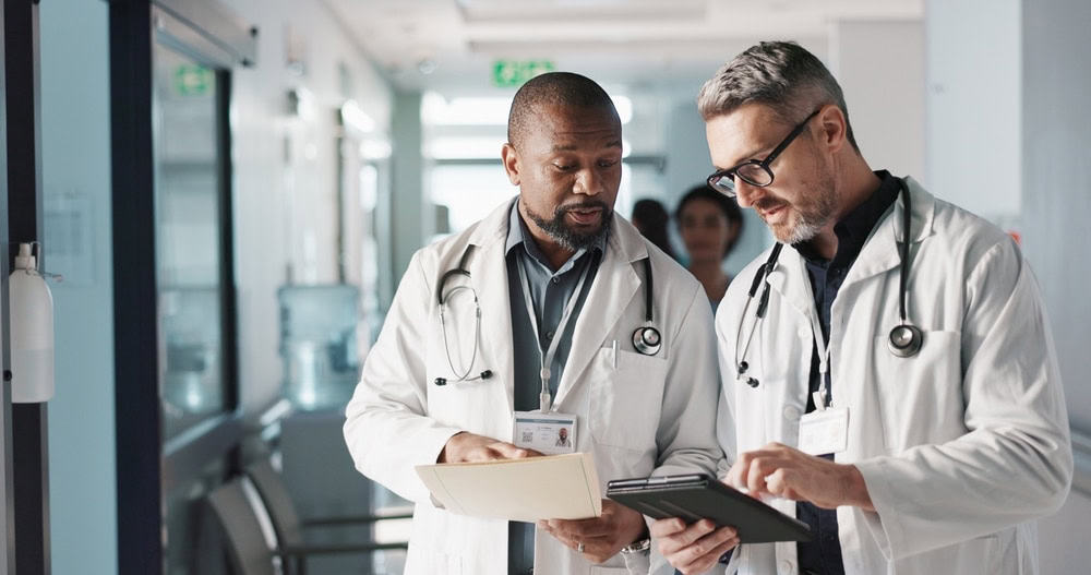 Doctors reviewing charts